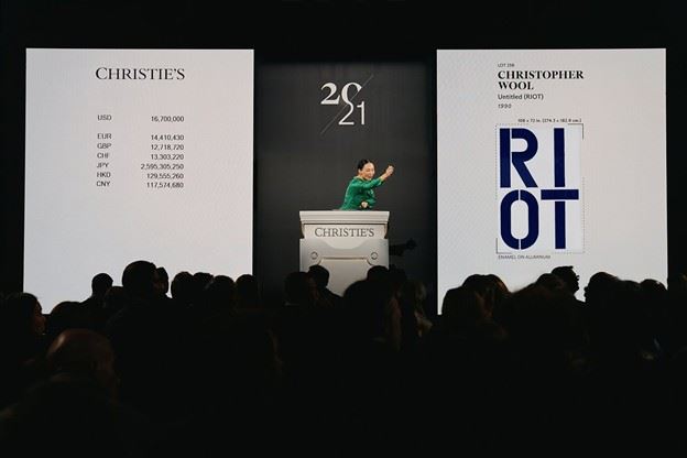 Christie’s auctioneer Yü-Ge Wang sells Christopher Wool's Untitled (Riot), 1990, at the 21st Century evening sale on February 19, 2025. Photo: Christie's